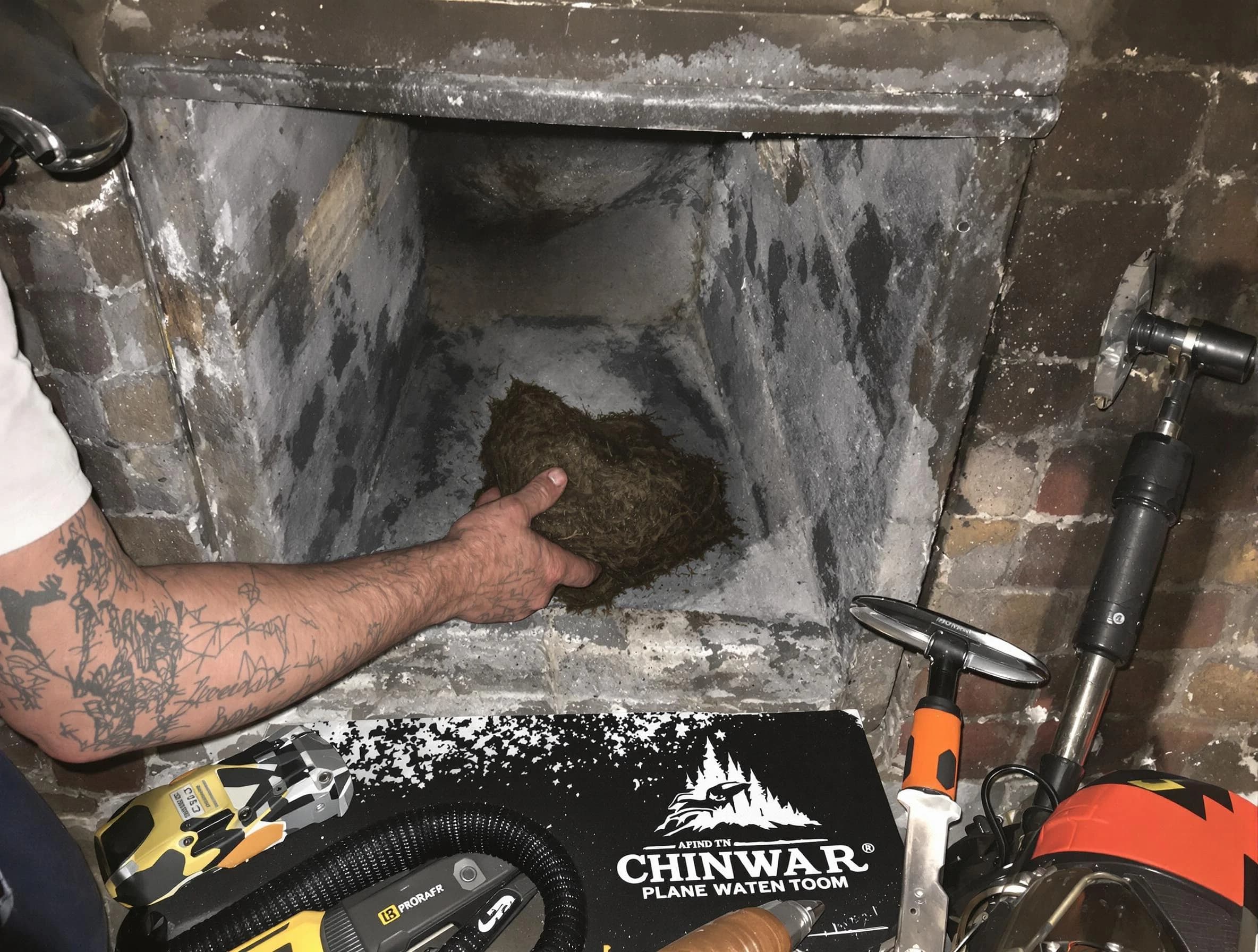 East Point Chimney Sweep safely removing debris and screening chimney in East Point, GA